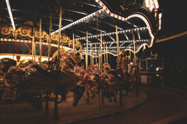 people riding on carousel during night time